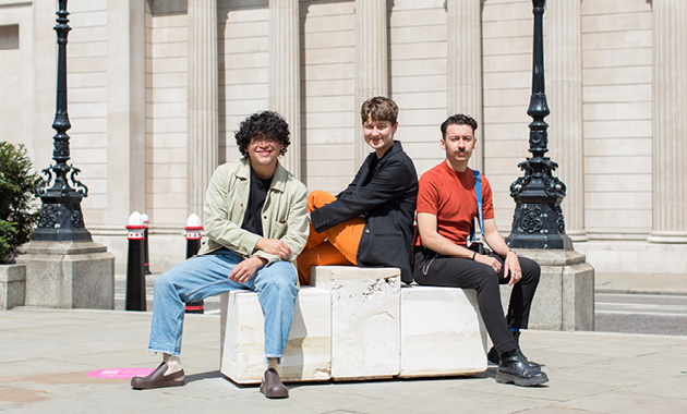 Jerry Florez, Dominika Pilch and Andrés Panduro of Pebble Haus, pictured sitting on the Sobremesa bench outside The Royal Exchange